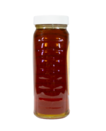 Side view of 16oz Bee With Nature organic raw honey jar showcasing the natural, unfiltered honey inside