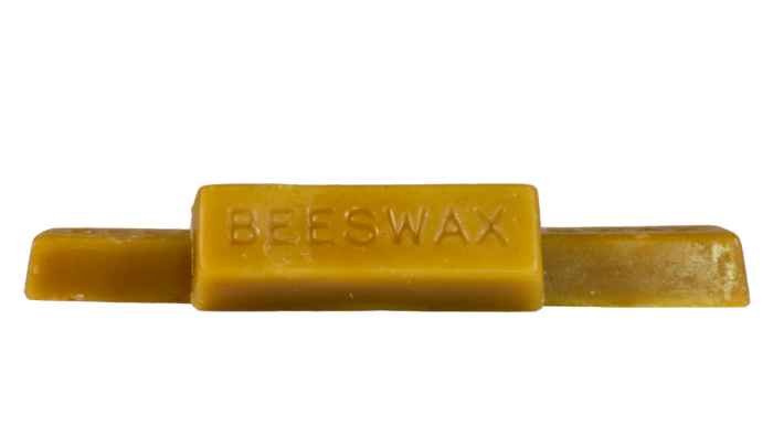 Single pure organic beeswax block with 'BEESWAX' engraved on it from Bee With Nature