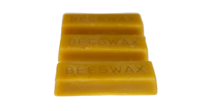 Set of 3 pure organic beeswax blocks lined up, each engraved with 'BEESWAX,' from Bee With Nature